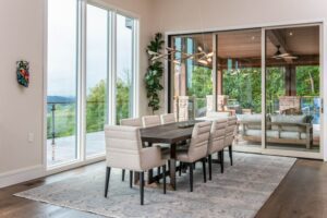 Dining Table Bathed in Natural Light Next to a Scenic Window