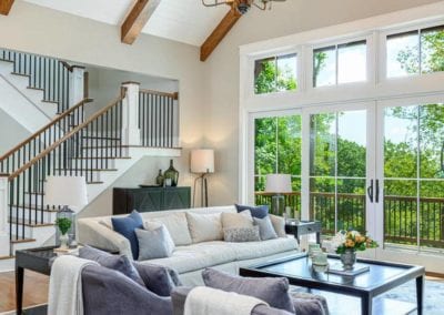 View of living area with large windows and french doors