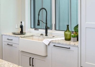 Large kitchen basin with sprayer hose faucet