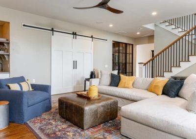 Living room seating with large sliding doors in background