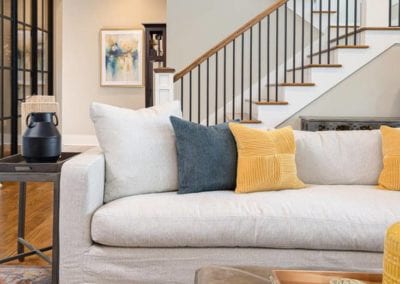 Living room with view of stairs