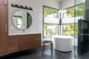 Bathroom with ample natural light and a scenic outdoor view.