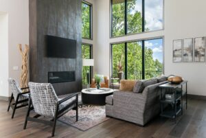 Living room with expansive floor-to-ceiling windows offering a captivating view.