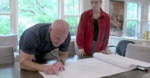 Sean Sullivan reviews a client’s custom home blueprint