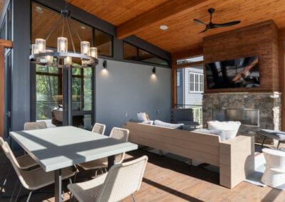 Living Stone Design+Build Screened in Porch with TV