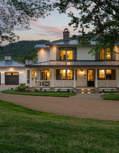 Remodeled energy-efficient house near Asheville, North Carolina, by luxury home builder with original farmhouse aspects, locally milled wood, exposed beams, and natural elements.