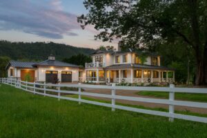 Remodeled energy-efficient luxury home near Asheville, North Carolina, incorporating original farmhouse aspects, locally milled wood, exposed beams, and natural elements.